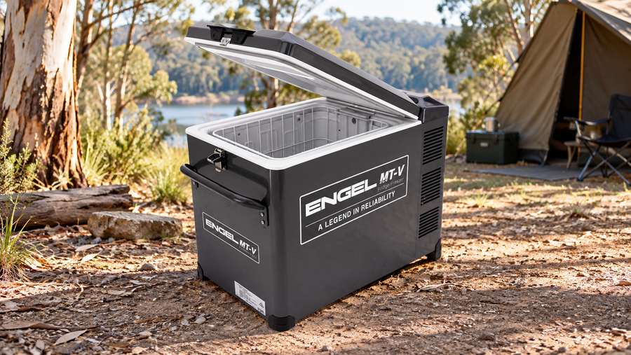 Engel MT-V45F camping fridge with its lid open beside a tent at a eucalyptus campsite.